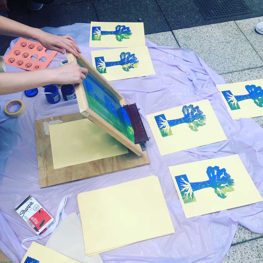 Printing outdoors screen with tree graphics drying