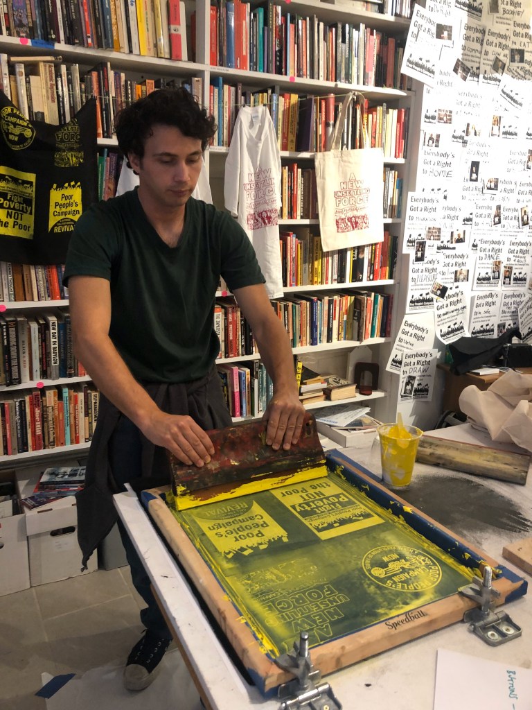 Person printing at Poor People's Campaign media making event